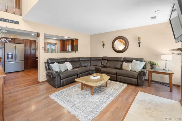 a living room with furniture and a rug