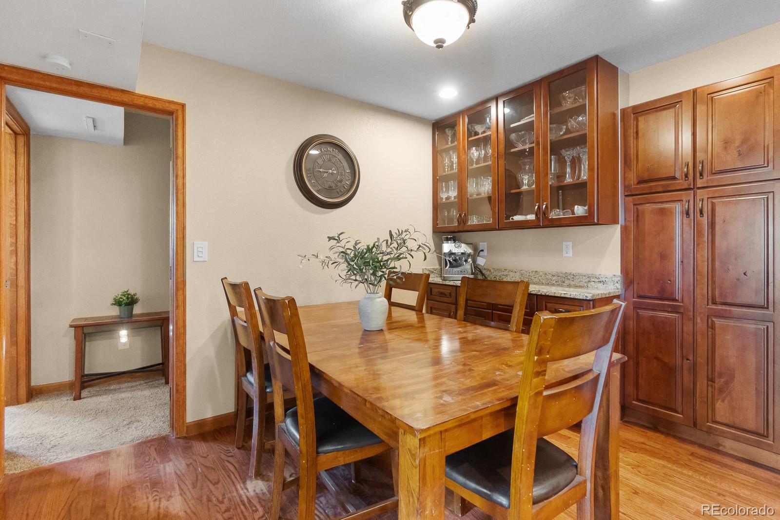 3163 Windstream Lane Elizabeth, CO 80107 - Photo 9 of 48 a view of a dining room with furniture and chandelier