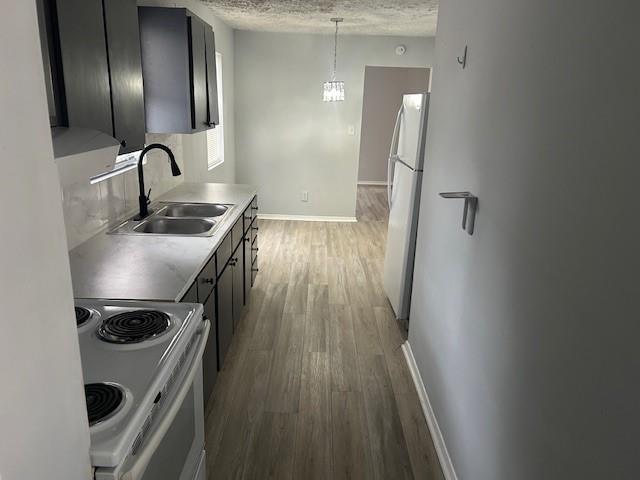 1833 Terry Mill Road Southeast Atlanta, GA 30316 - Photo 12 of 22 a kitchen with wooden floor and stainless steel appliances
