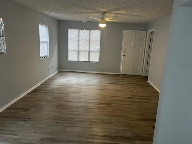 1833 Terry Mill Road Southeast Atlanta, GA 30316 - Photo 13 of 22 an empty room with wooden floor and windows