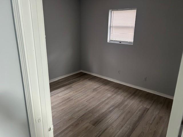 1833 Terry Mill Road Southeast Atlanta, GA 30316 - Photo 19 of 22 an empty room with wooden floor and windows
