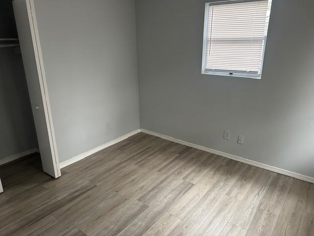1833 Terry Mill Road Southeast Atlanta, GA 30316 - Photo 22 of 22 an empty room with wooden floor and windows
