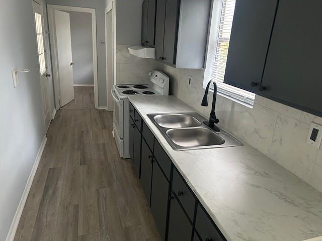 1833 Terry Mill Road Southeast Atlanta, GA 30316 - Photo 10 of 22 a kitchen with a sink a stove and cabinets