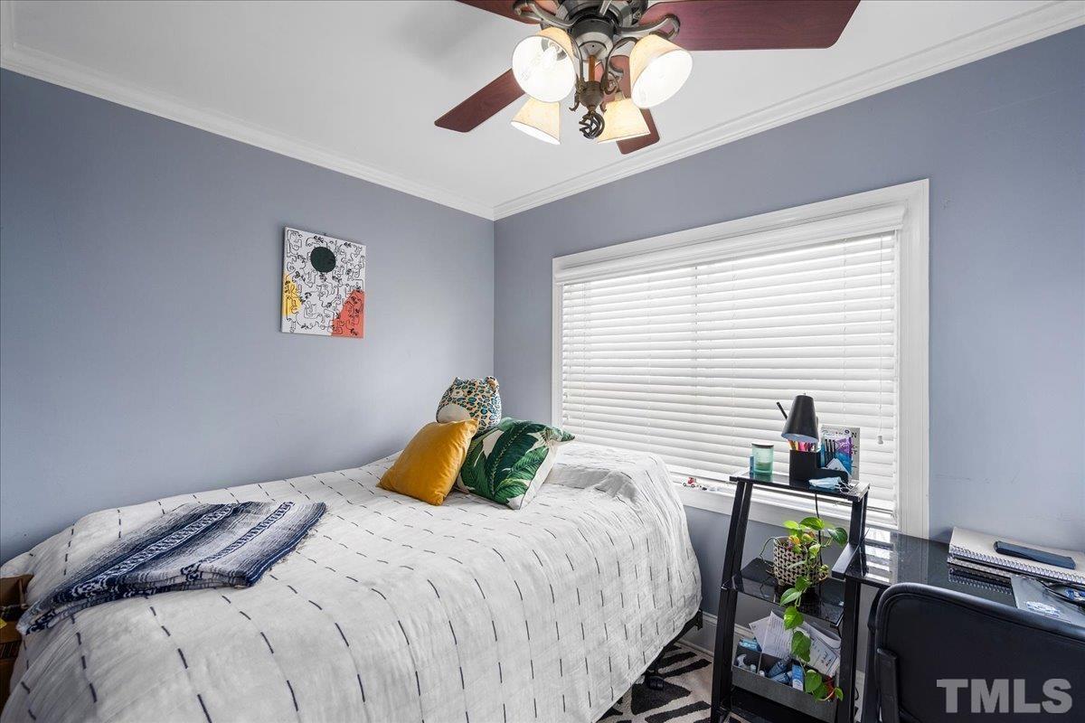 3225 Merriman Avenue Raleigh, NC 27607 - Photo 11 of 19 a bedroom with a bed and a window