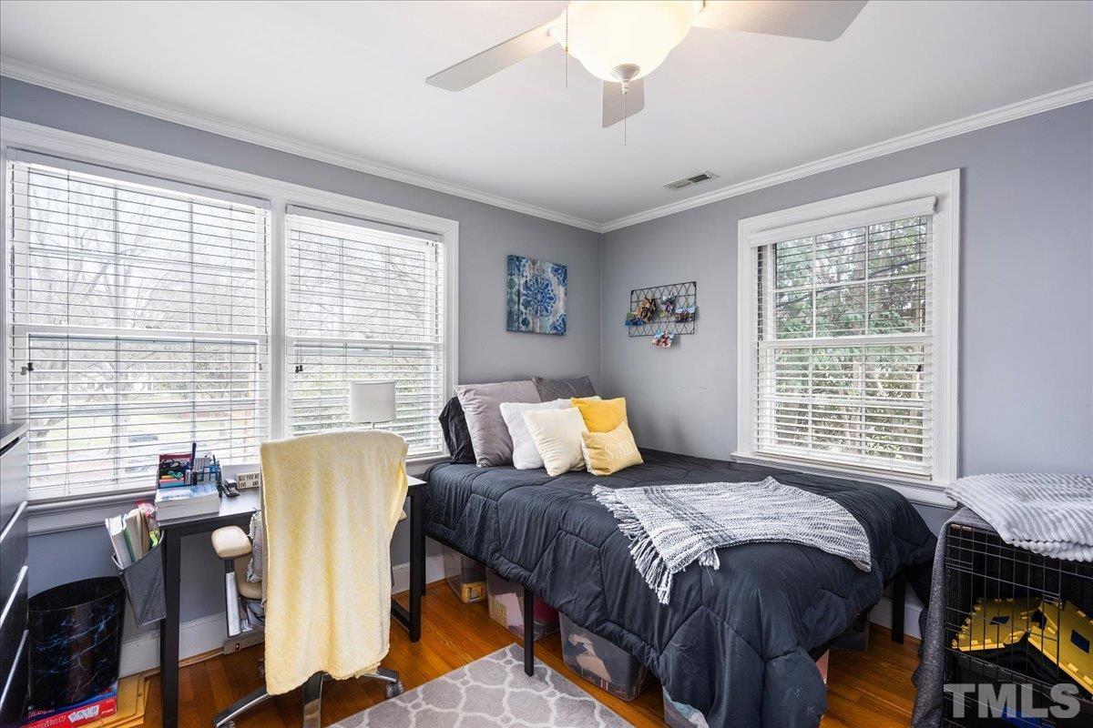 3225 Merriman Avenue Raleigh, NC 27607 - Photo 13 of 19 a bed room with a bed and a window