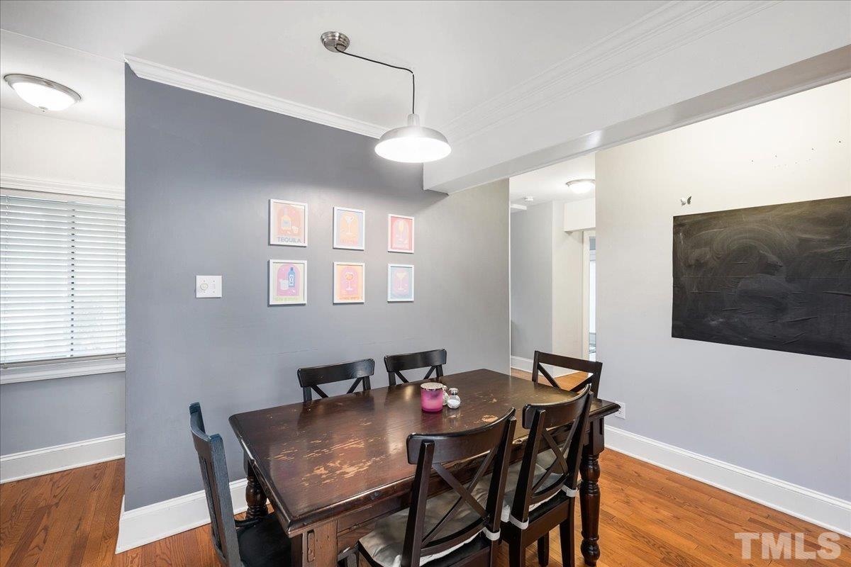 3225 Merriman Avenue Raleigh, NC 27607 - Photo 6 of 19 a view of a dining room with furniture and wooden floor