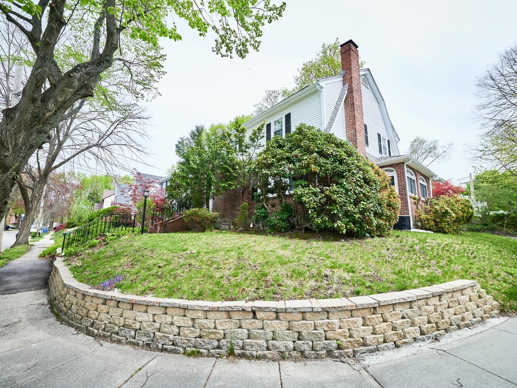 205 Bonad Road Brookline, MA 02467 - Photo 4 of 17 a front view of a house with a yard