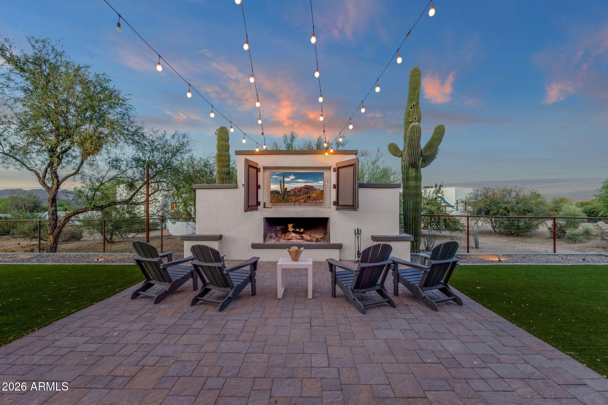 14604 East Peak View Road Scottsdale, AZ 85262 - Photo 30 of 55 a view of a patio with dining table and chairs with a garden