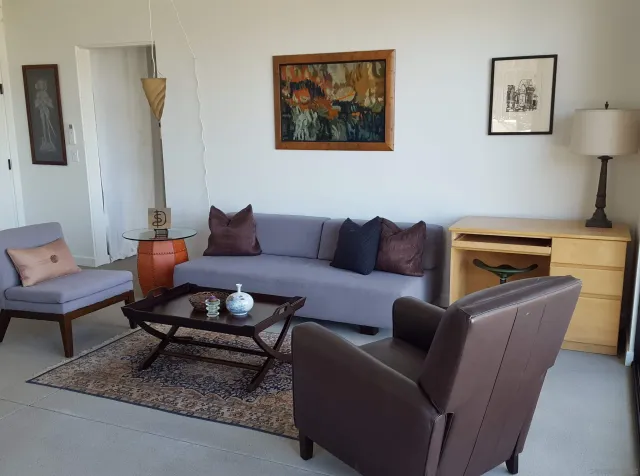 a living room with furniture and a rug