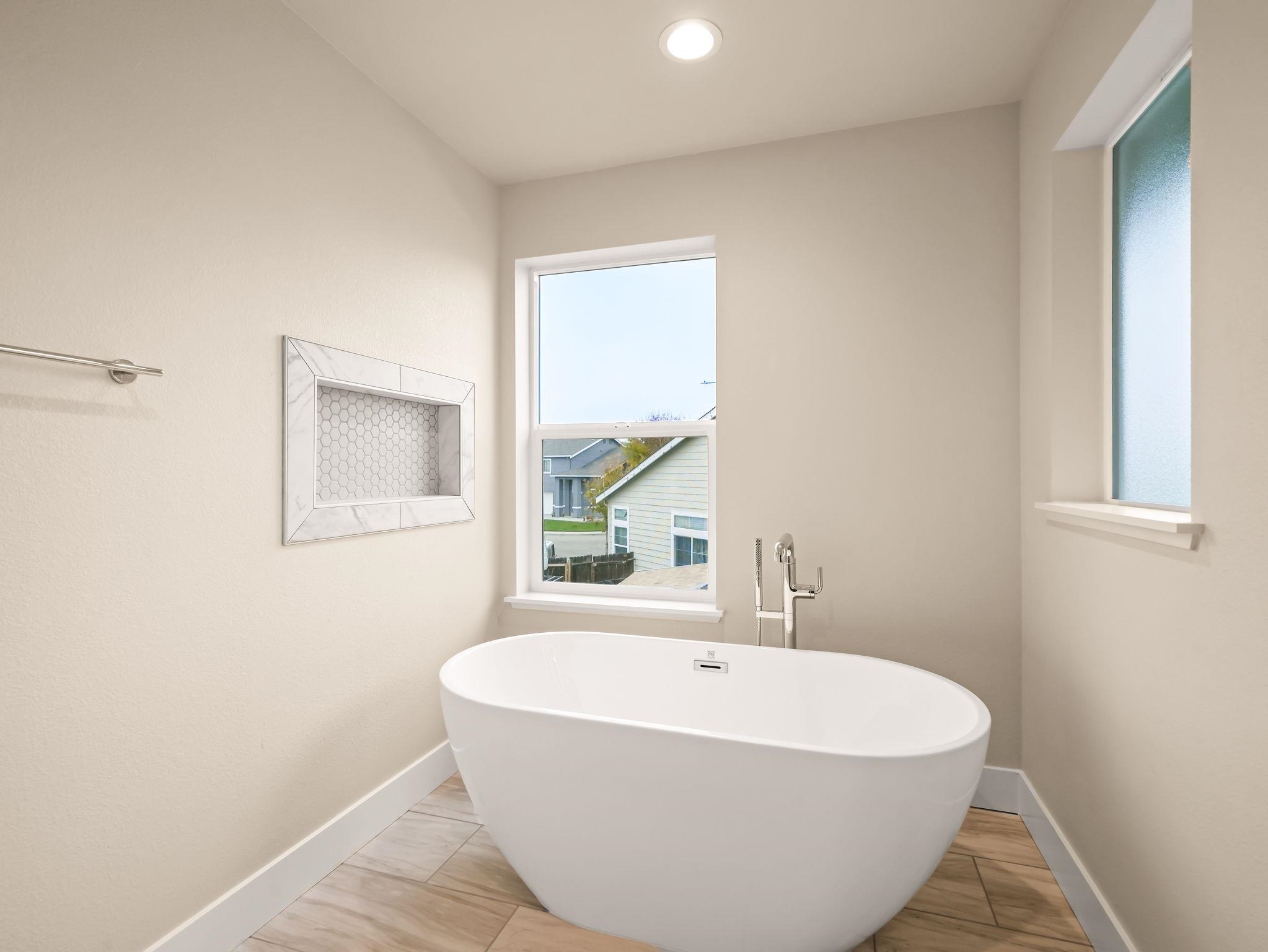 3030 Byron Road Tracy, CA 95377 - Photo 15 of 21 a white bath tub sitting in a bathroom