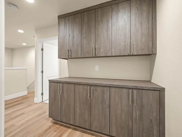 a bathroom with a shower sink and mirror