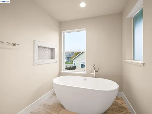 a white bath tub sitting in a bathroom