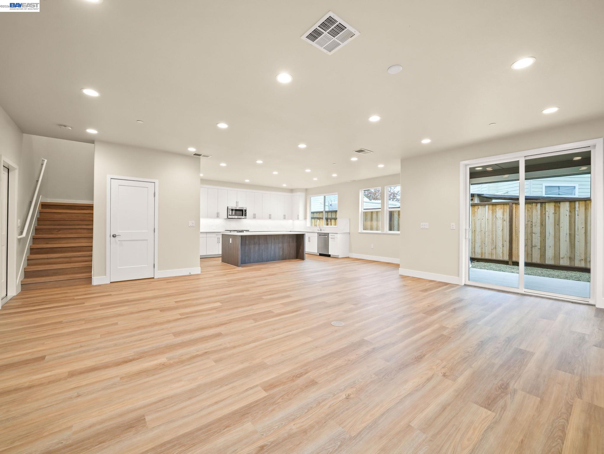 3030 Byron Road Tracy, CA 95377 - Photo 9 of 21 a view of an empty room with wooden floor and a window