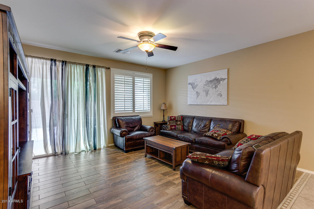 2226 East Gillcrest Road Gilbert, AZ 85298 - Photo 9 of 49 a living room with furniture and a large window