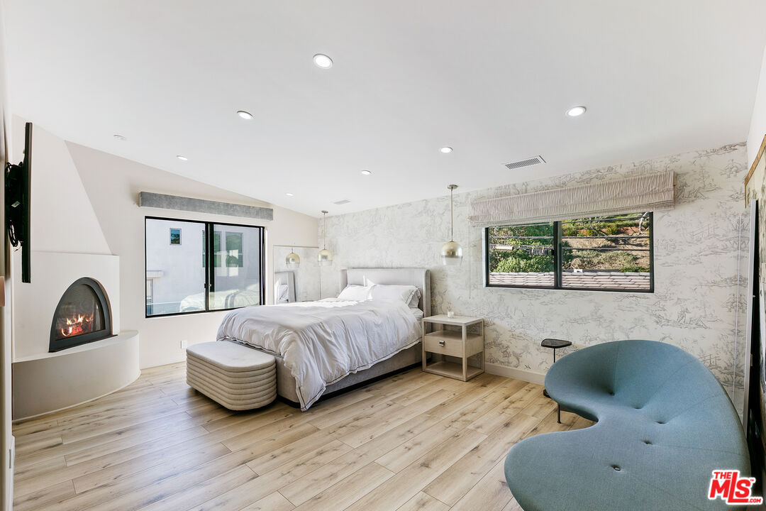 25216 Malibu Road Malibu, CA 90265 - Photo 12 of 21 a bedroom with bed and a large window