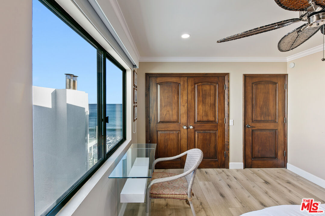 25216 Malibu Road Malibu, CA 90265 - Photo 17 of 21 a view of a hallway with furniture and windows
