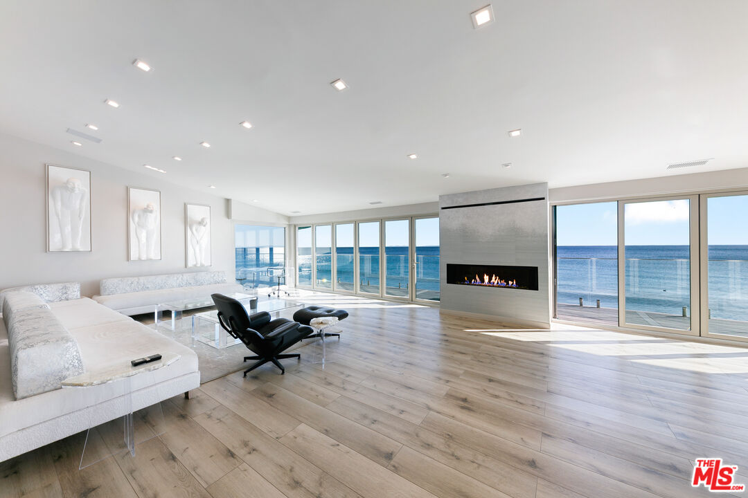 25216 Malibu Road Malibu, CA 90265 - Photo 2 of 21 a living room with furniture and a wooden floor