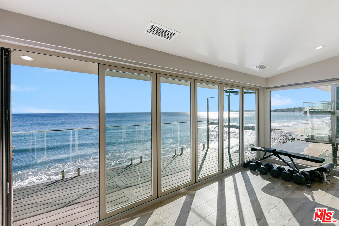 25216 Malibu Road Malibu, CA 90265 - Photo 4 of 21 a view of a room with wooden floor and a balcony