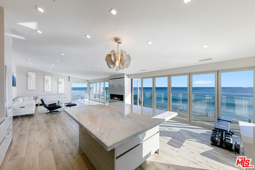25216 Malibu Road Malibu, CA 90265 - Photo 7 of 21 a living room with stainless steel appliances granite countertop furniture and a wooden floor