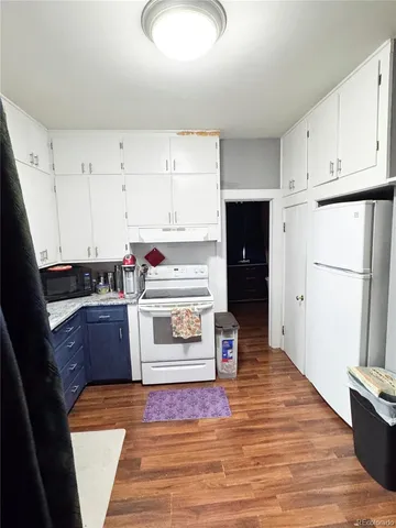 a kitchen with stainless steel appliances a stove a refrigerator and cabinets