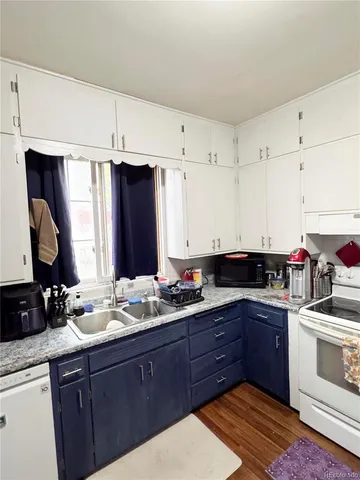 a kitchen with a sink and cabinets