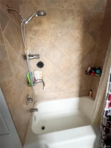 a bathroom with a bath tub