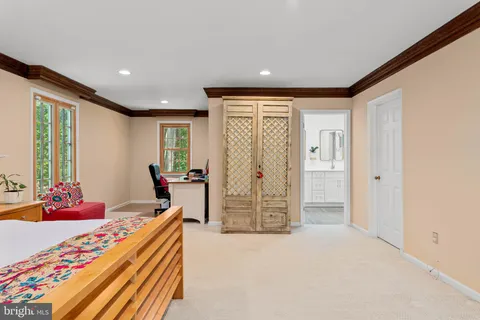 a bed room with a bed and a window