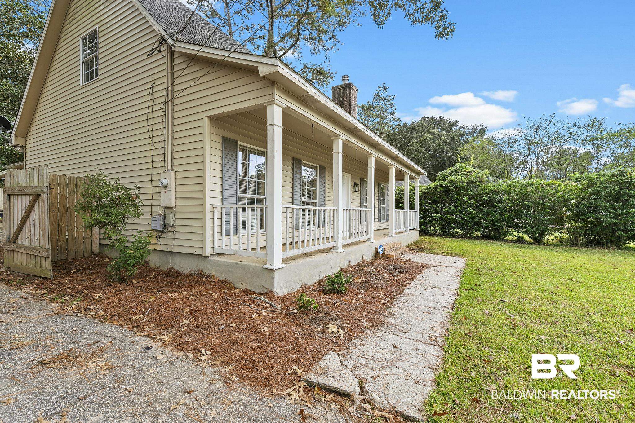 474 Ridgewood Drive Daphne, AL 36526 - Photo 6 of 57 View of side of home featuring a yard and a porch