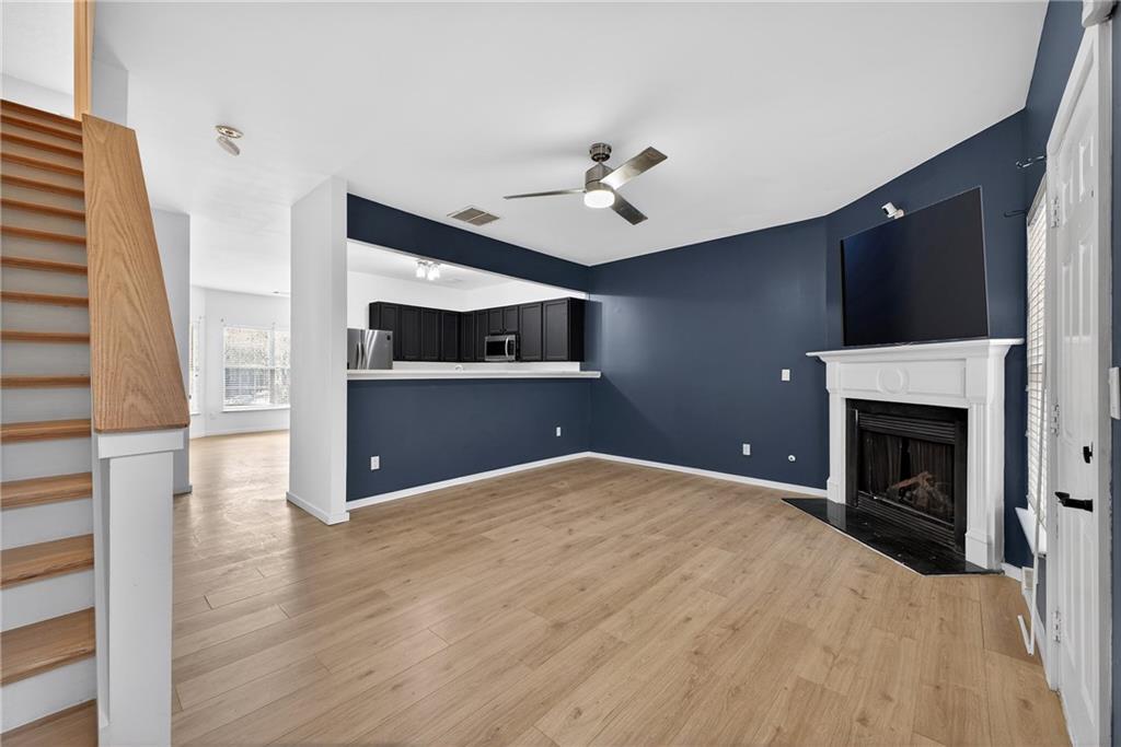 2527 Walden Lake Drive Decatur, GA 30035 - Photo 11 of 23 a view of empty room with kitchen and fireplace
