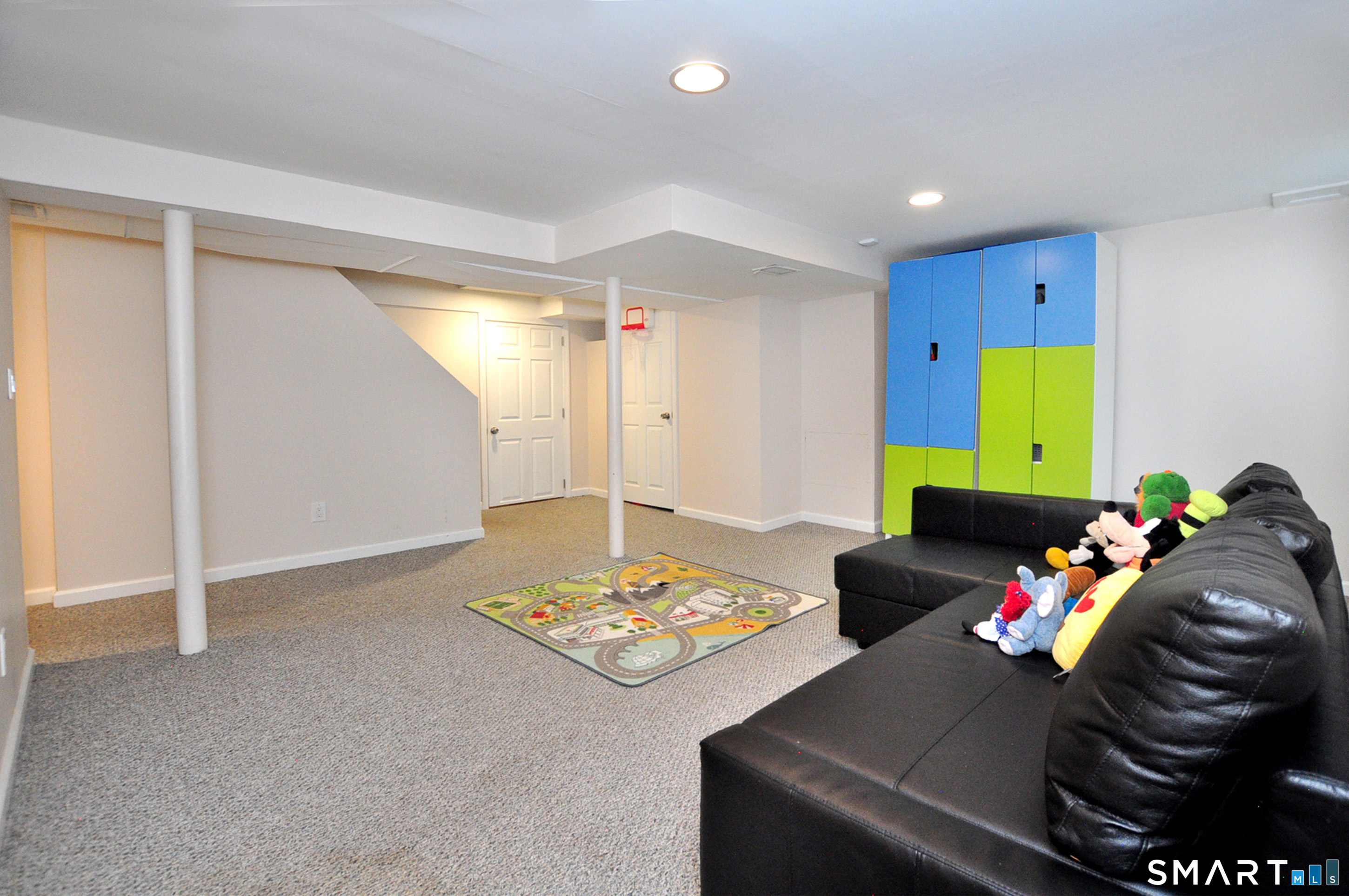 16 Miamis Road West Hartford, CT 06117 - Photo 31 of 39 Fully furnished basement offers plenty of play and storage space, Egress window plus a full bathroom and additional bedroom, perfect for overnight guests!