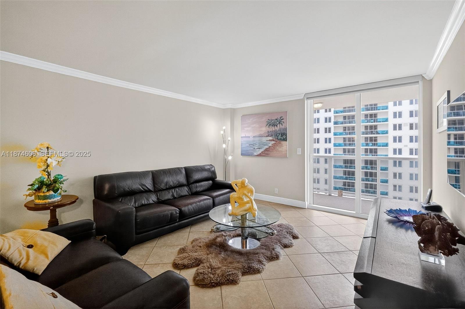 2401 Collins Avenue, Unit 1005 Miami Beach, FL 33140 - Photo 3 of 19 a living room with furniture and a large window