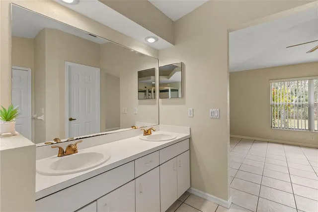 a bathroom with a sink double vanity and a shower