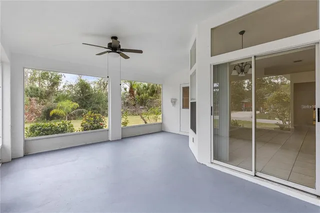an empty room with windows and outdoor view