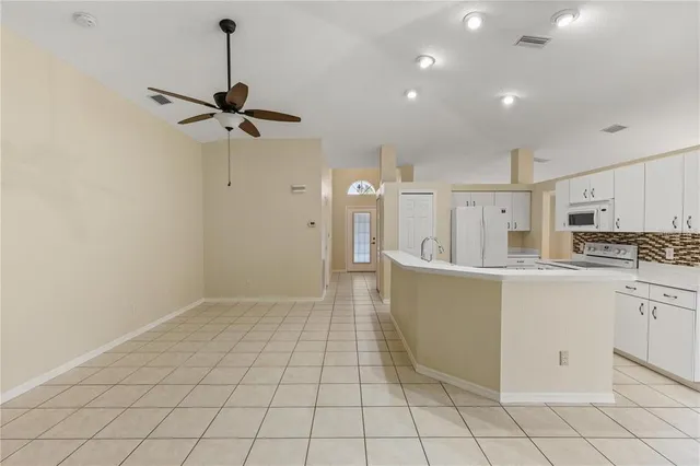 a view of a kitchen with electric appliances