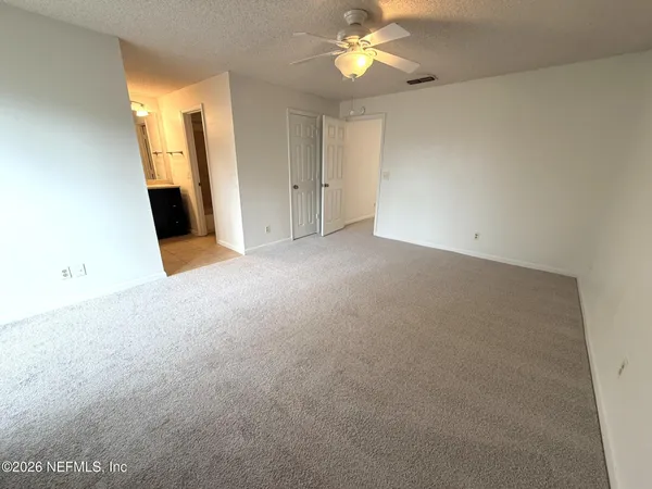 an empty room with a bathroom