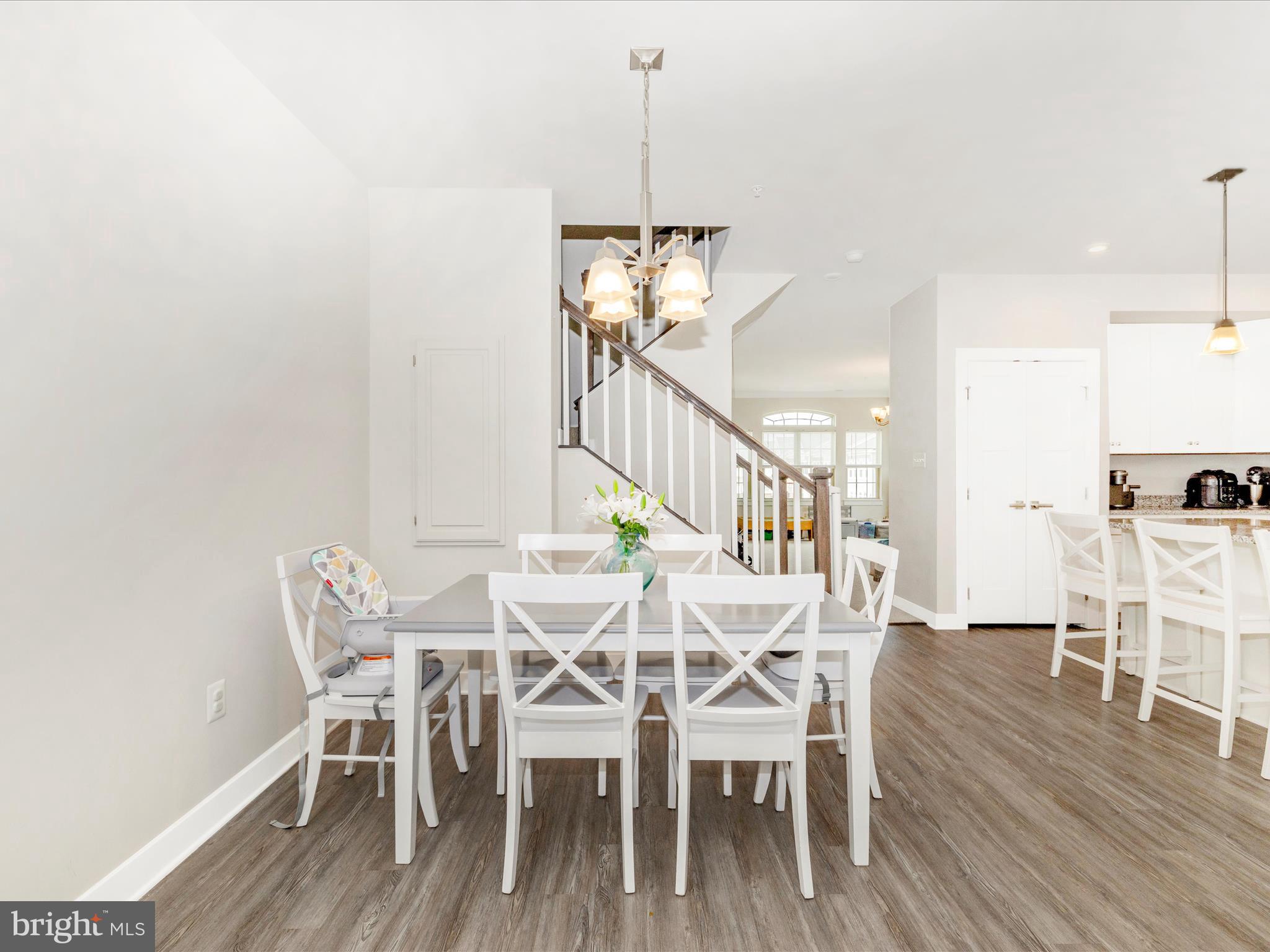 6020 Forum Square Frederick, MD 21703 - Photo 14 of 54 a dining room with furniture and wooden floor