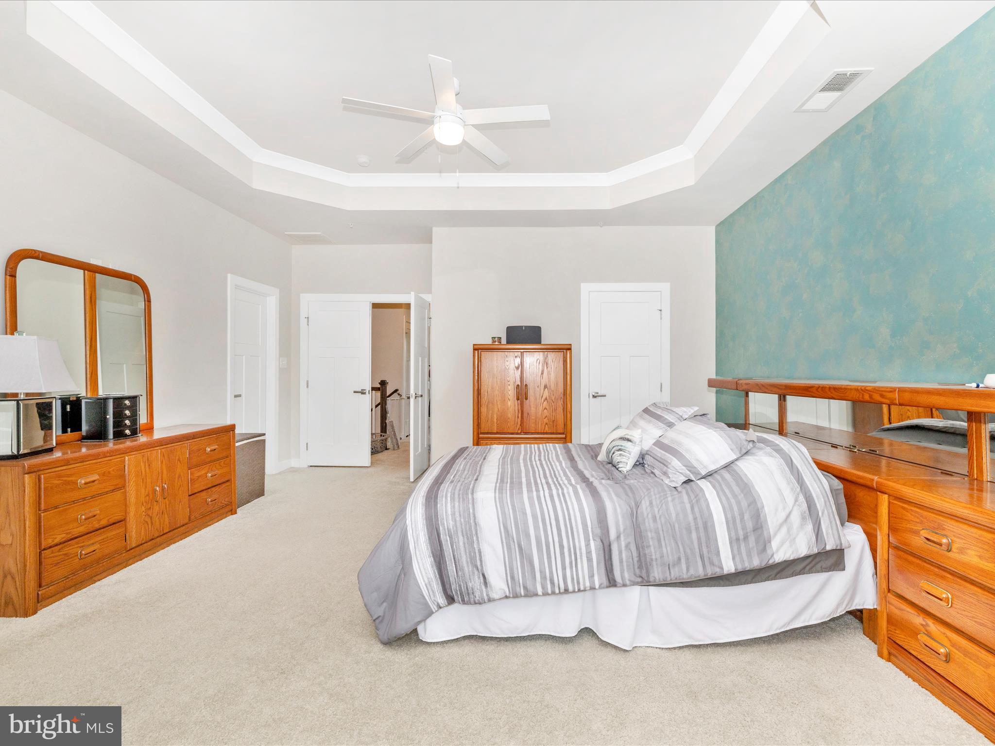 6020 Forum Square Frederick, MD 21703 - Photo 20 of 54 a bedroom with a bed and dresser with mirror