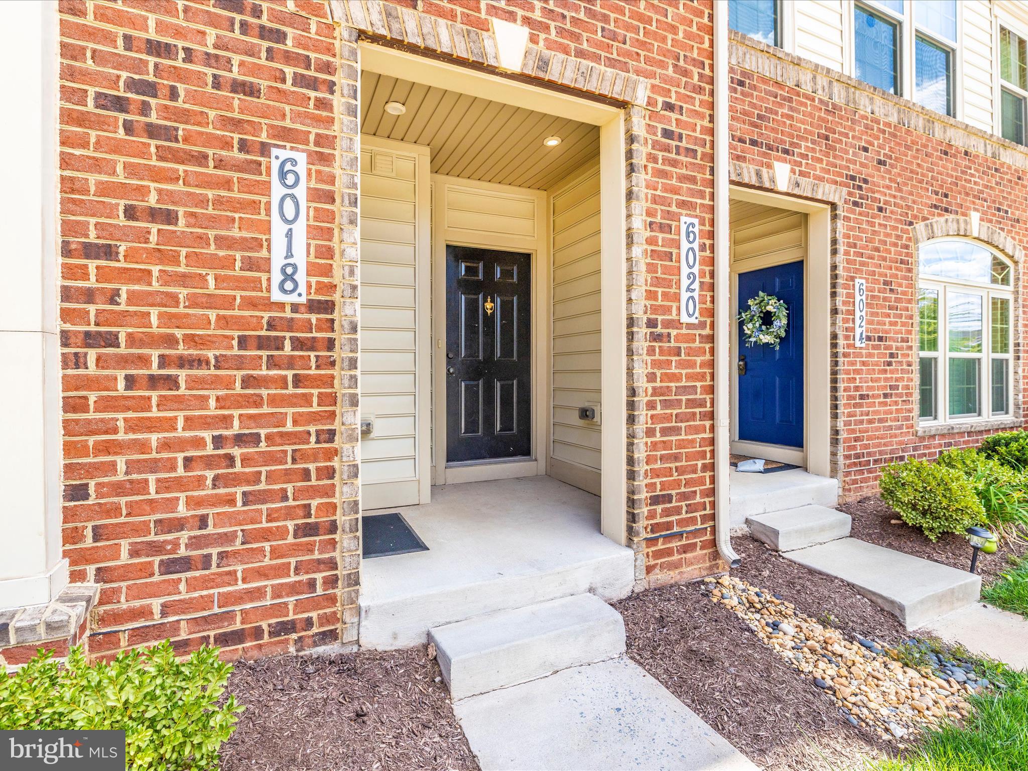 6020 Forum Square Frederick, MD 21703 - Photo 2 of 54 a view of a brick house with a large windows