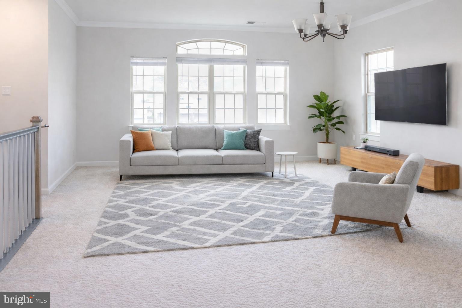 6020 Forum Square Frederick, MD 21703 - Photo 3 of 54 a living room with furniture and a flat screen tv