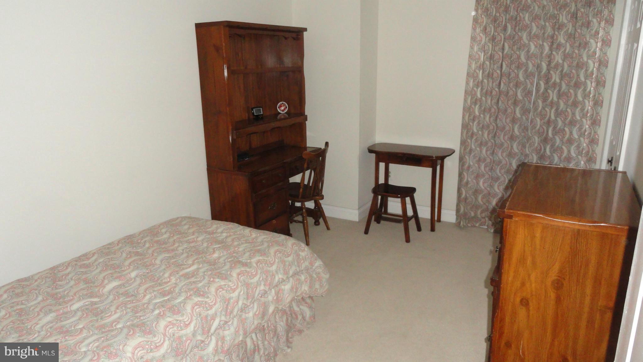 301 Carriage Run Road Annapolis, MD 21403 - Photo 14 of 26 a bedroom with a bed and a dresser