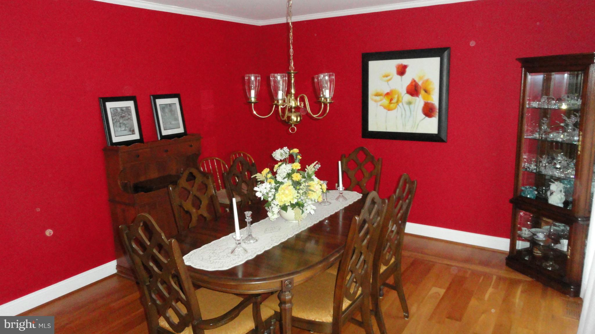 301 Carriage Run Road Annapolis, MD 21403 - Photo 3 of 26 a dining room with furniture and wooden floor
