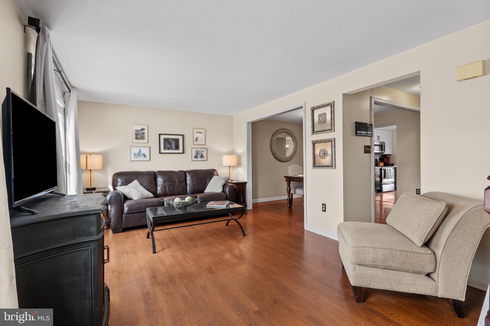 8024 Hollow Reed Court Frederick, MD 21701 - Photo 12 of 25 a living room with furniture and a flat screen tv