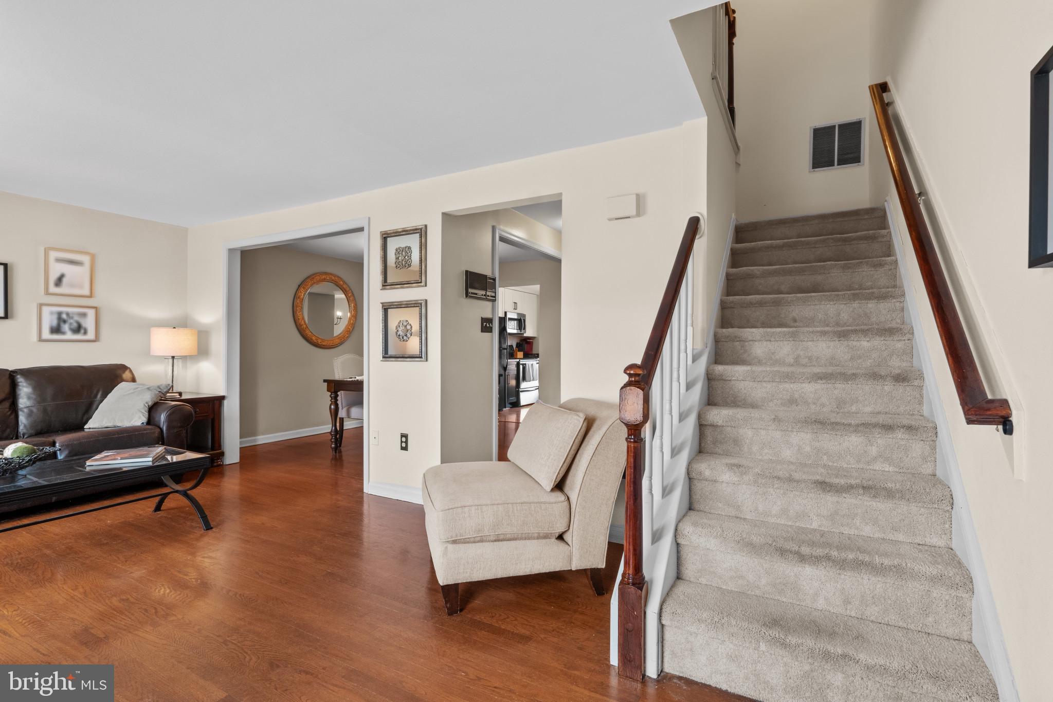 8024 Hollow Reed Court Frederick, MD 21701 - Photo 13 of 25 a living room with furniture and a clock