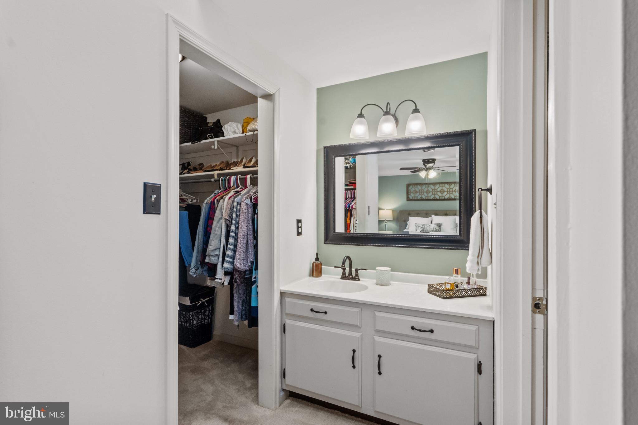 8024 Hollow Reed Court Frederick, MD 21701 - Photo 16 of 25 a bathroom with a sink vanity and a mirror