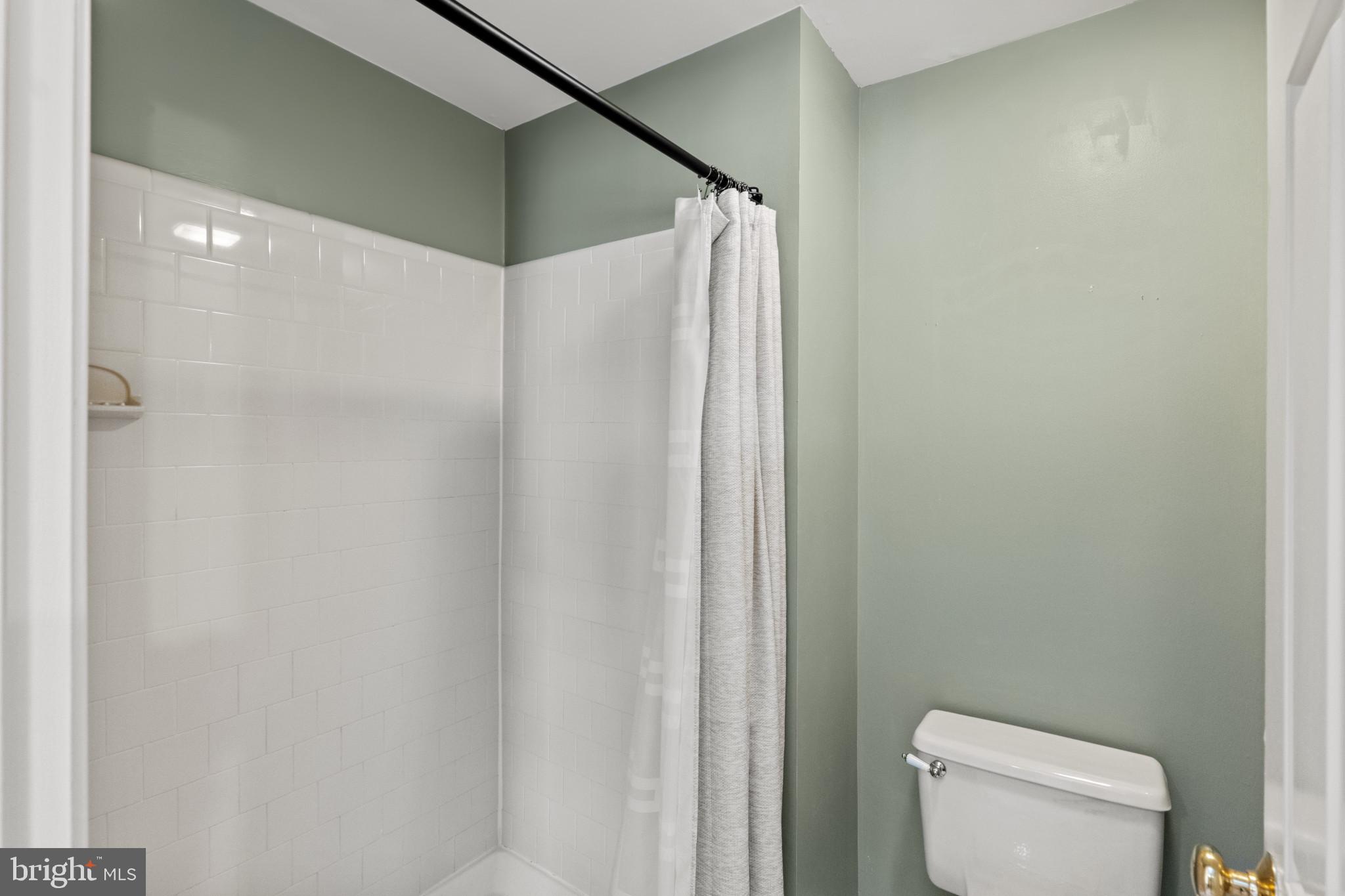 8024 Hollow Reed Court Frederick, MD 21701 - Photo 17 of 25 a bathroom with a shower and toilet