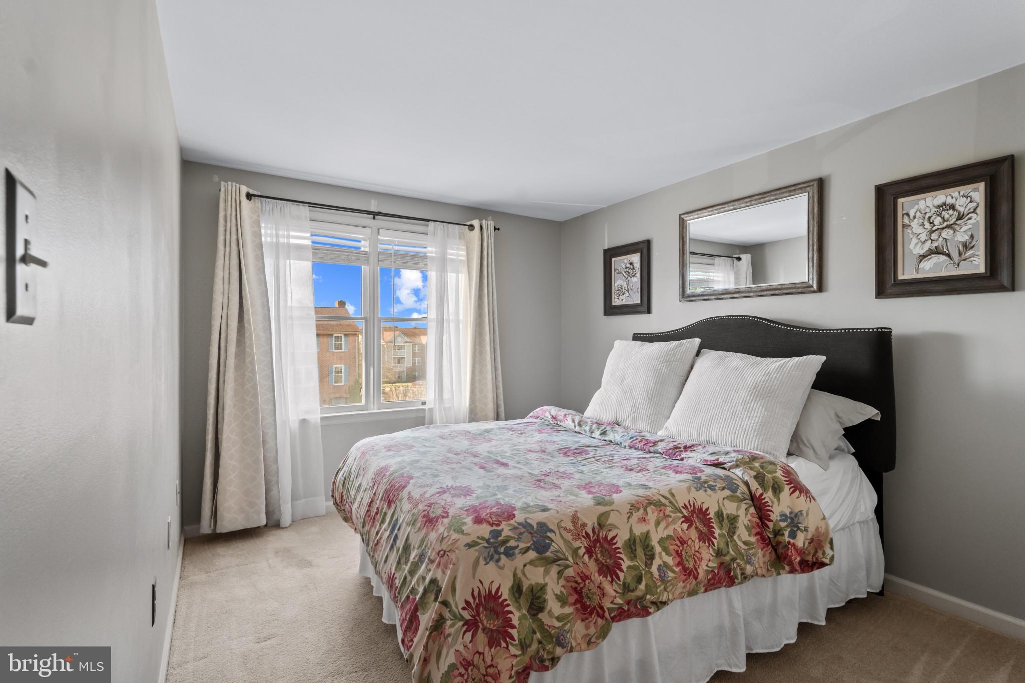 8024 Hollow Reed Court Frederick, MD 21701 - Photo 21 of 25 a bed sitting in a bedroom next to a window