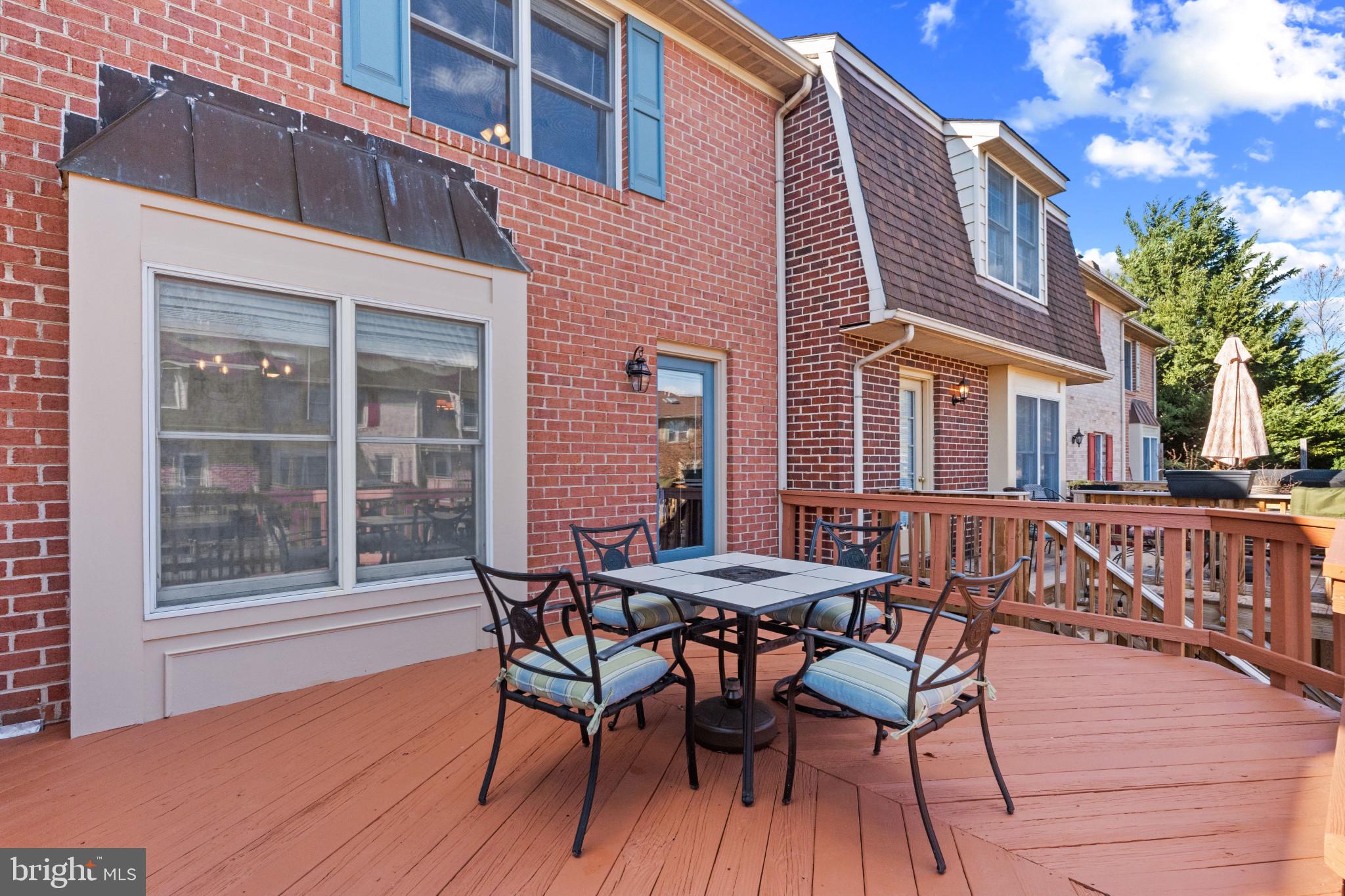 8024 Hollow Reed Court Frederick, MD 21701 - Photo 24 of 25 a view of a wooden chairs and table on the deck