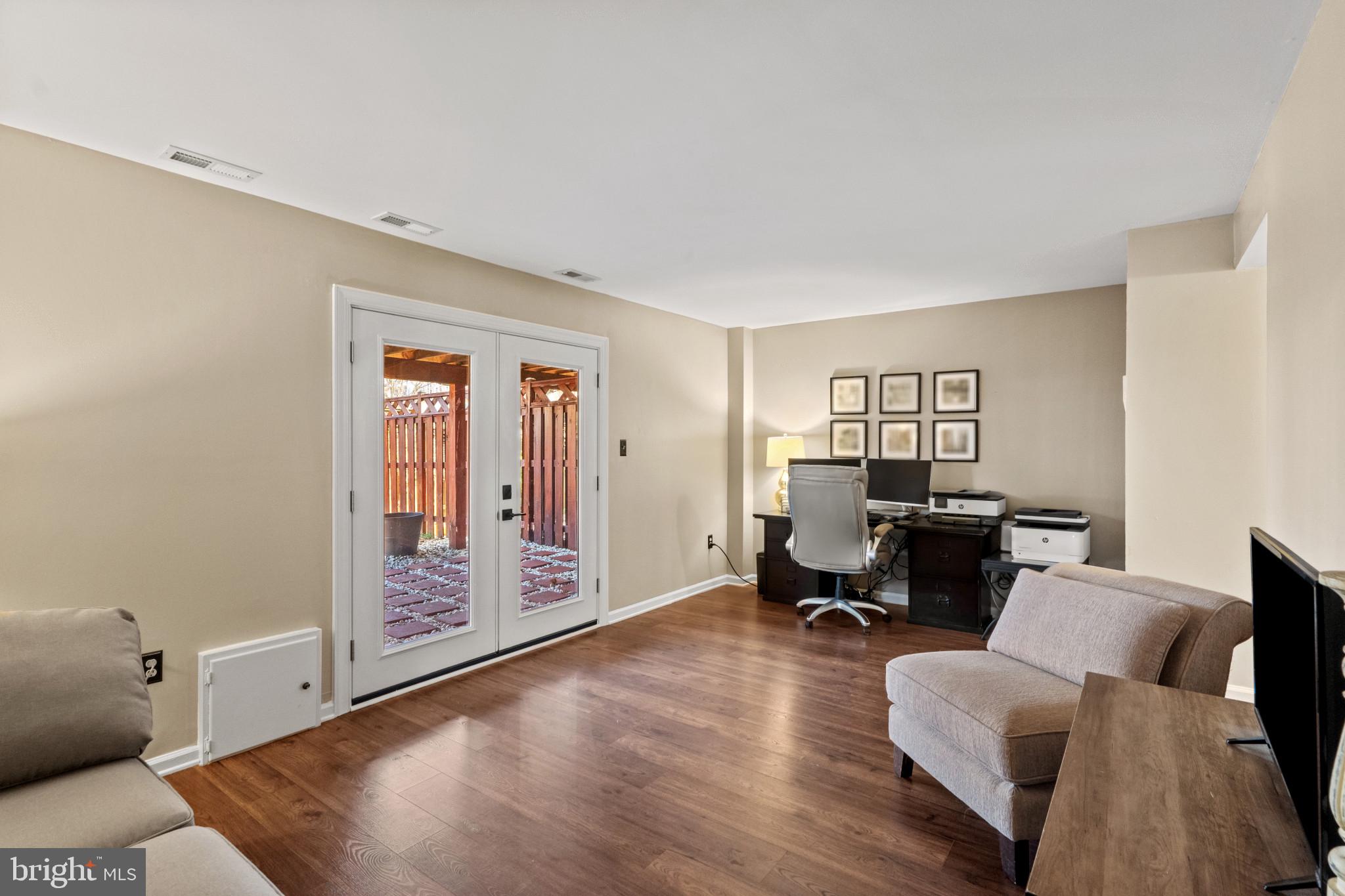 8024 Hollow Reed Court Frederick, MD 21701 - Photo 5 of 25 a view of a livingroom with workspace and a couch
