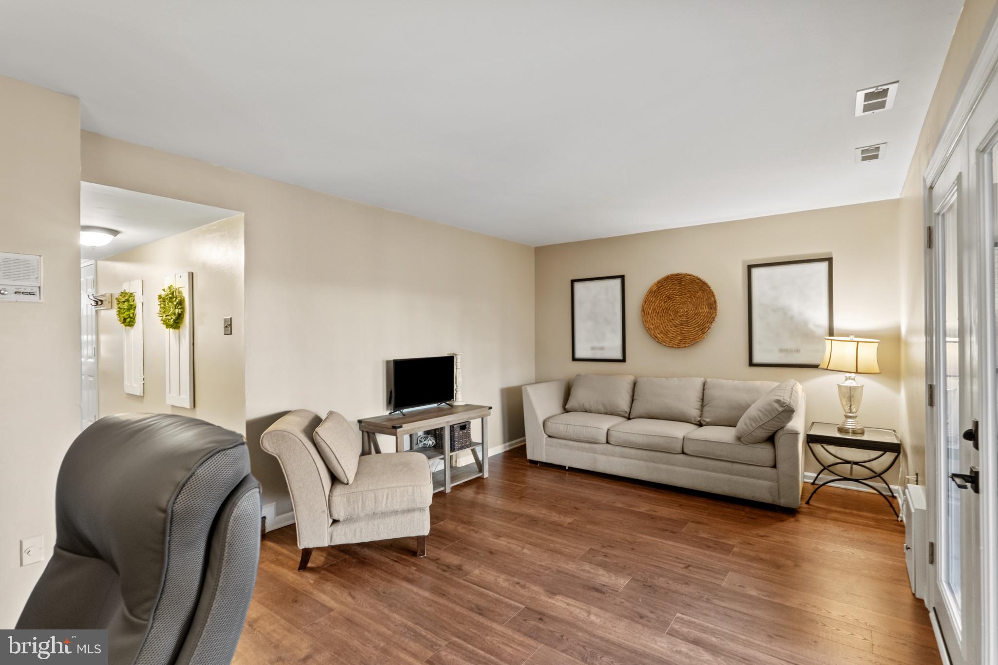 8024 Hollow Reed Court Frederick, MD 21701 - Photo 6 of 25 a living room with furniture and a flat screen tv