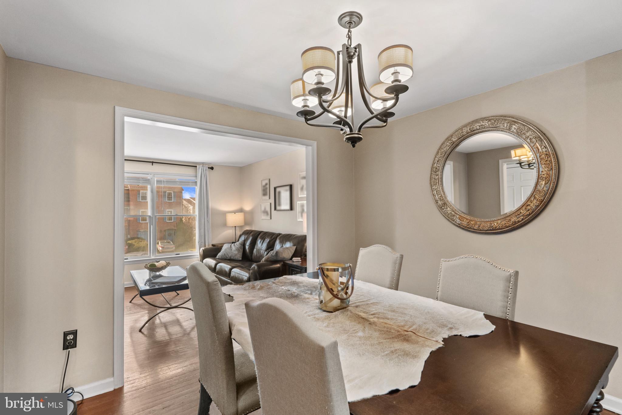 8024 Hollow Reed Court Frederick, MD 21701 - Photo 7 of 25 a view of a dining room with furniture wooden floor and a chandelier